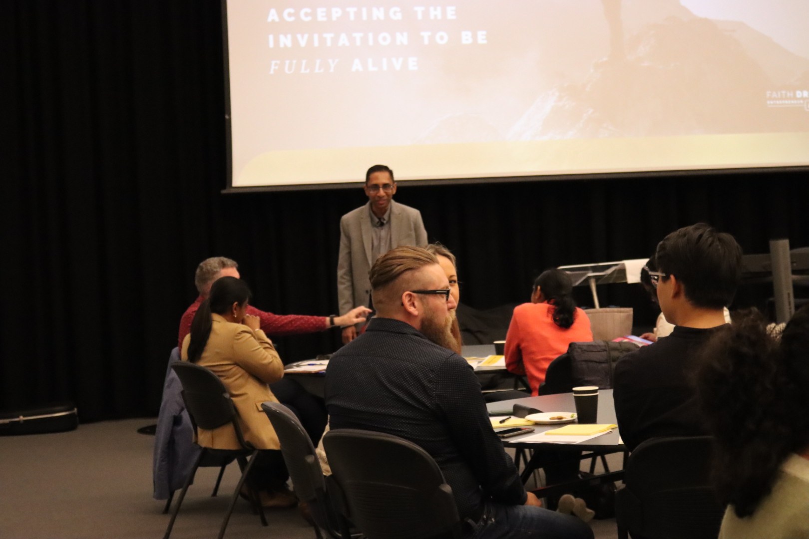 A speaker sharing with the community during a group session